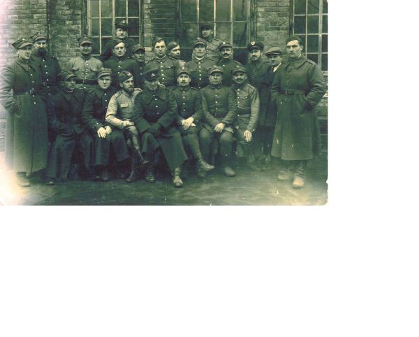  Рачуны Вялікія, маёнтак (Солы вясковая гміна). Photo of Stanislaw Sys (Virtuti Militari) (front centre with moustache and legs crossed) and cousin Bronislaw Stanislaw Sys (directly behind at the back facing right) taken after registering with the Red Cross in Lithuania in 1939 prior to being arrested by the Soviets.